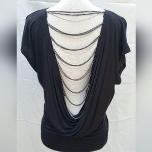 Black short sleeve top with chains design on back. Size M